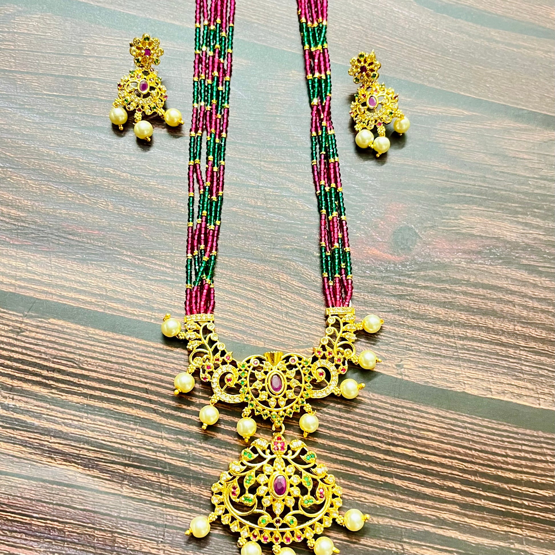traditional necklace, temple jewelry, bridal jewelry, ethnic wear, gold finish, Indian necklace, pearl necklace, antique jewelry, wedding jewelry, designer jewelry, South Indian jewelry, festive look, handmade jewelry, ruby green beads, jewelry for saree, party wear jewelry, statement necklace, trending jewelry, jewelry set, ethnic necklace, earrings and necklace, kundan work, bridal set, beaded necklace, pearl drops