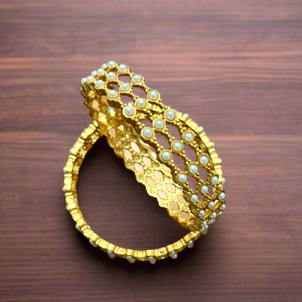 pearl mesh bangles, gold tone bangles, bridal bangles set, traditional kada bangles, pearl kada for women, ethnic bangle set, Indian wedding bangles, festive wear bangles, gold pearl kada, handcrafted bangles, royal pearl bangles, mesh design bangles, kundan style bangles, designer bangles online, party wear bangles for saree