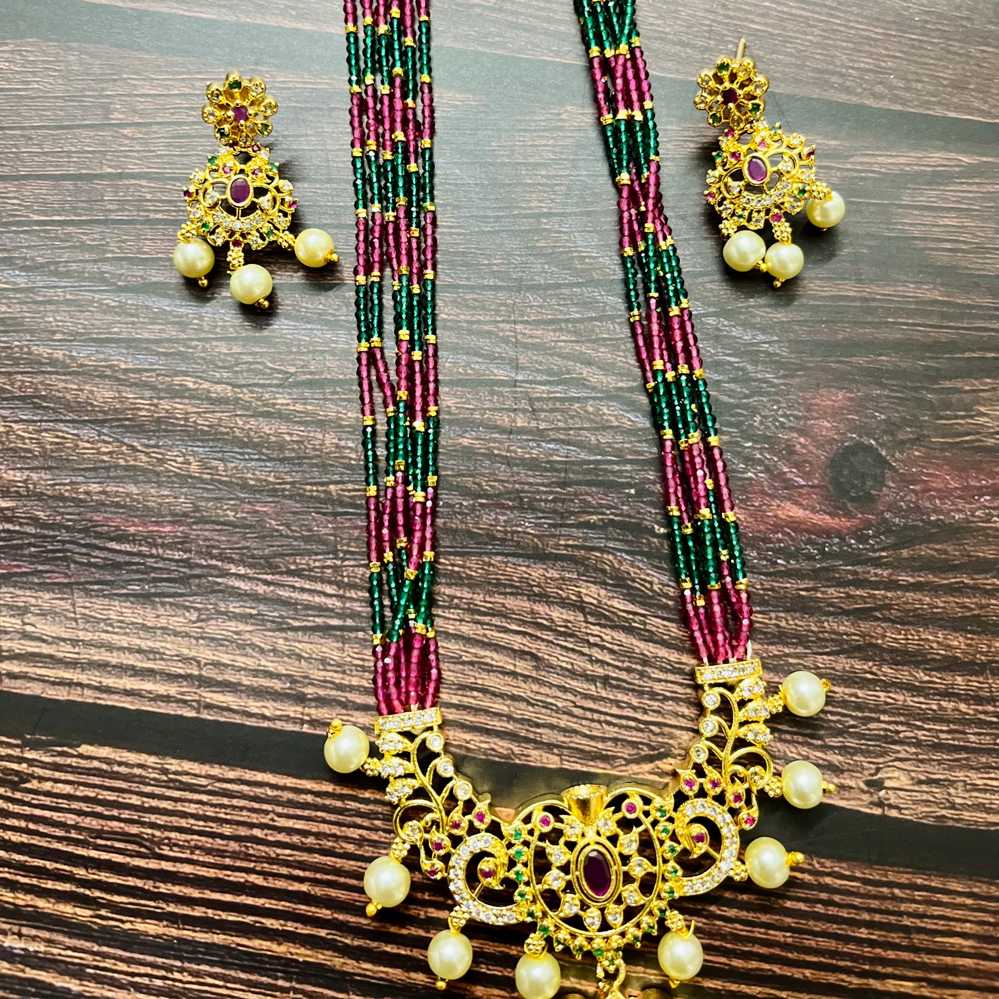 traditional necklace, temple jewelry, bridal jewelry, ethnic wear, gold finish, Indian necklace, pearl necklace, antique jewelry, wedding jewelry, designer jewelry, South Indian jewelry, festive look, handmade jewelry, ruby green beads, jewelry for saree, party wear jewelry, statement necklace, trending jewelry, jewelry set, ethnic necklace, earrings and necklace, kundan work, bridal set, beaded necklace, pearl drops