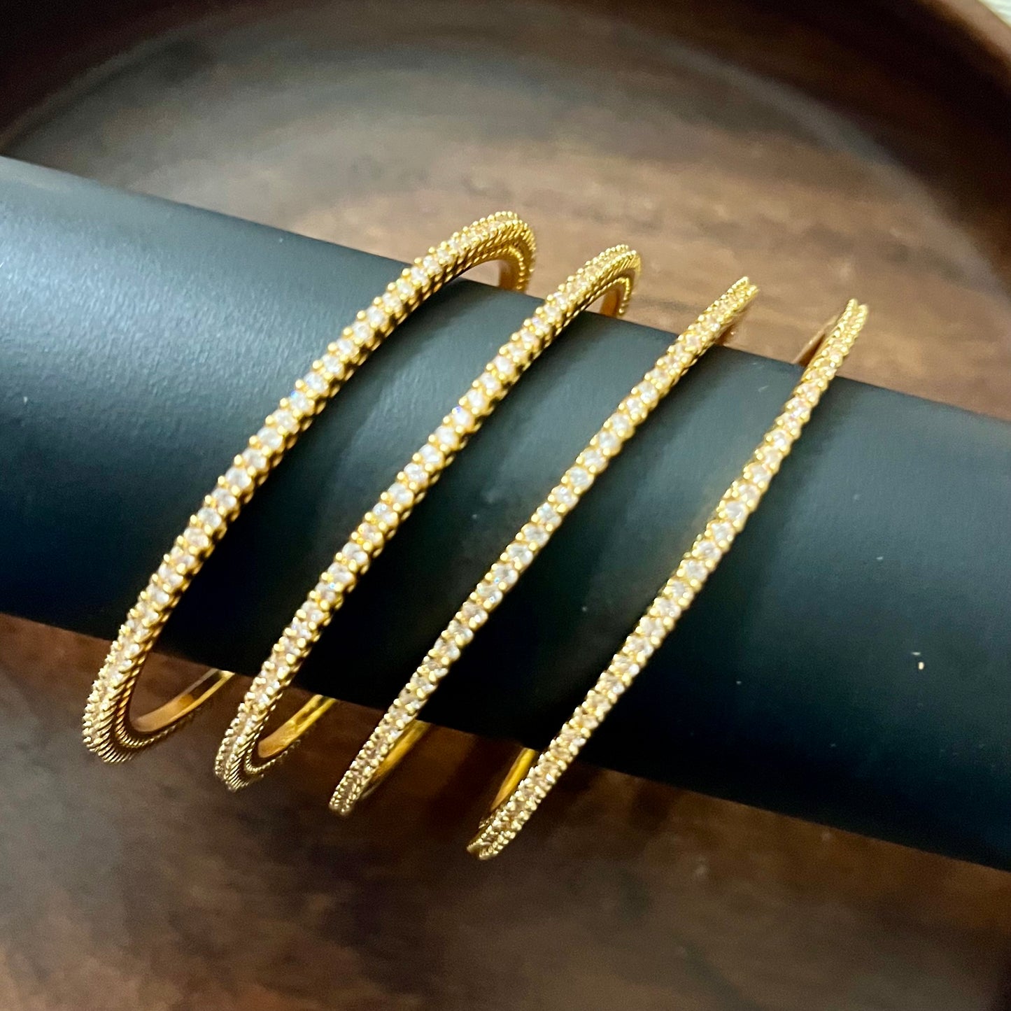 minimalist bangles, crystal bangles, pink stone bangles, gold plated bangles, dainty bangles, everyday wear bangles, party wear bangles, stackable bangles, thin bangles set, American diamond bangles, elegant bangles for women, lightweight bangles, trendy bangles, festive bangles, wedding guest jewelry, handmade bangles India, stylish bangles online, office wear bangles, fashion bangles for girls, bangle set for gifting