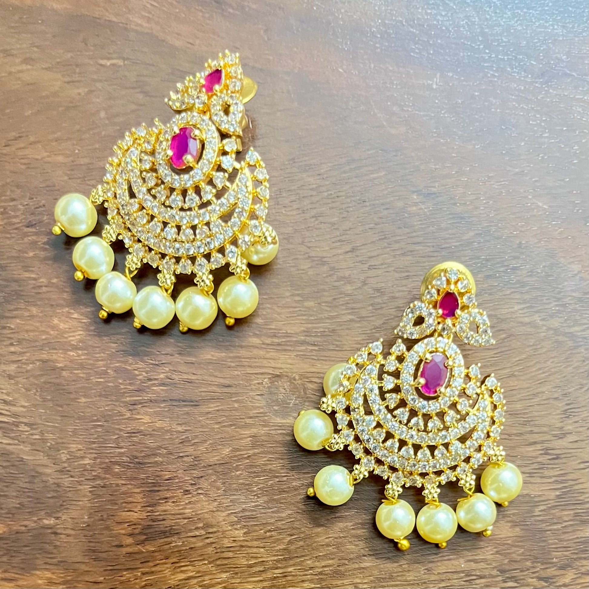 traditional jewelry set, pearl necklace set, ruby stone jewelry, gold tone necklace, bridal jewelry set, Indian jewelry, ethnic necklace, wedding jewelry, festive jewelry, pearl and ruby set, designer necklace set, kundan style jewelry, South Indian jewelry, statement necklace, handcrafted jewelry, imitation jewelry, choker necklace set, temple jewelry style, elegant jewelry set, party wear jewelry