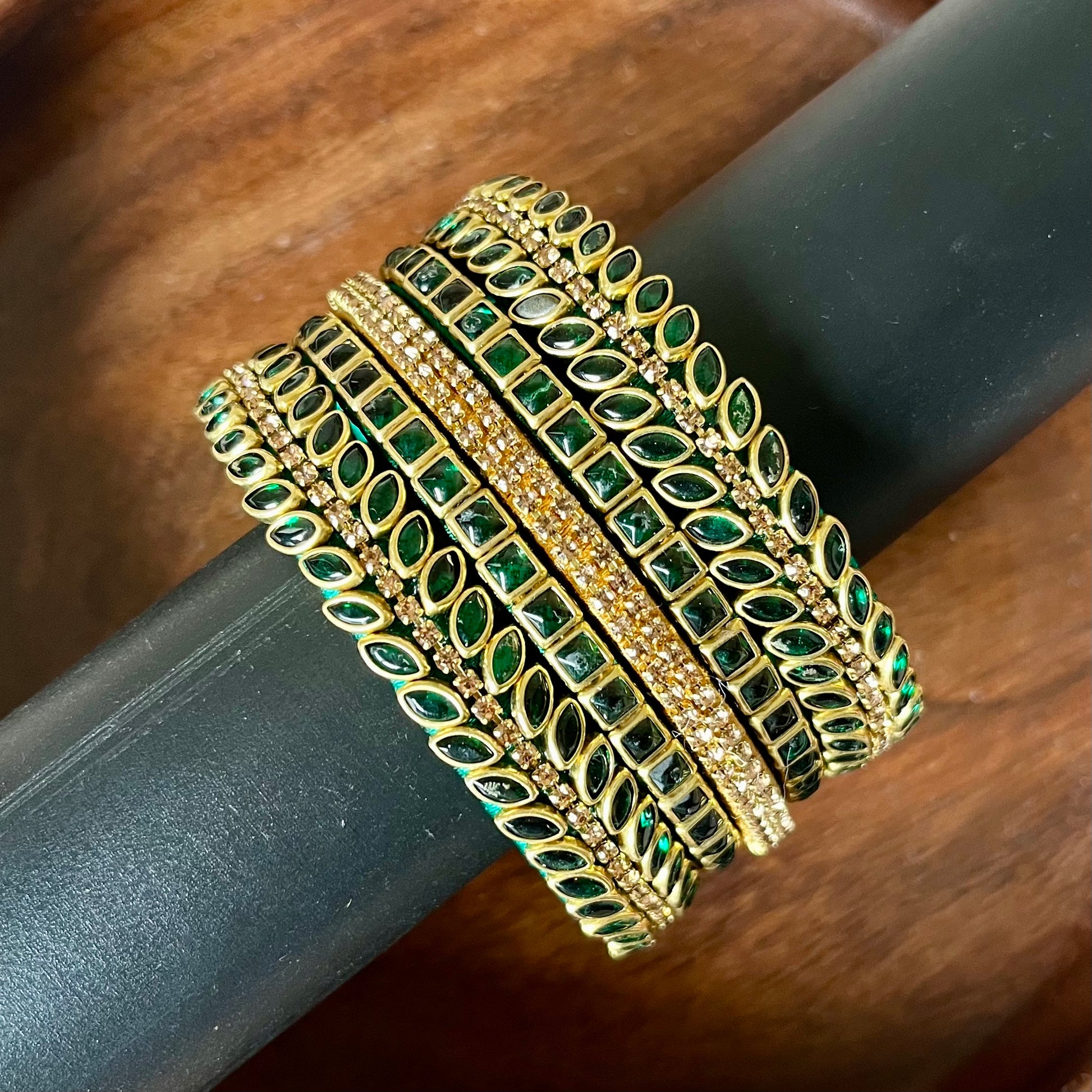 green bangles, gold bangles, bangle set, traditional bangles, Indian bangles, festive jewelry, bridal bangles, emerald bangles, ethnic jewelry, designer bangles, wedding accessories, party wear bangles, handmade bangles, stone bangles, jewelry for saree