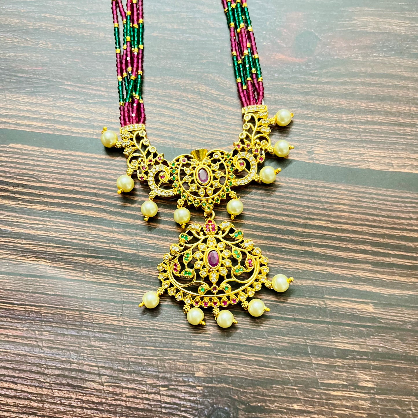traditional necklace, temple jewelry, bridal jewelry, ethnic wear, gold finish, Indian necklace, pearl necklace, antique jewelry, wedding jewelry, designer jewelry, South Indian jewelry, festive look, handmade jewelry, ruby green beads, jewelry for saree, party wear jewelry, statement necklace, trending jewelry, jewelry set, ethnic necklace, earrings and necklace, kundan work, bridal set, beaded necklace, pearl drops