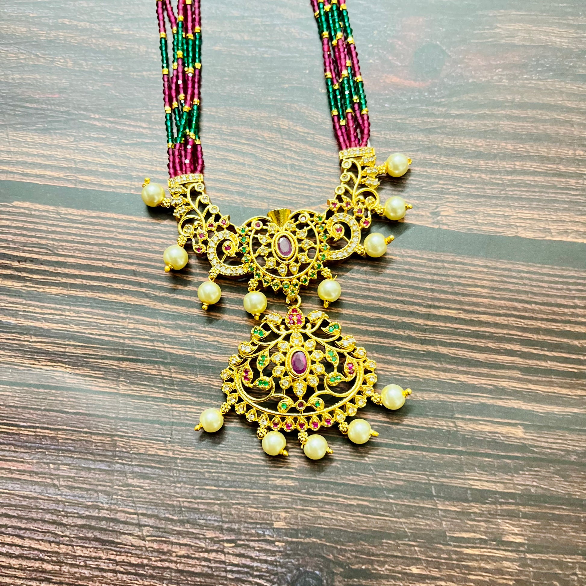 traditional necklace, temple jewelry, bridal jewelry, ethnic wear, gold finish, Indian necklace, pearl necklace, antique jewelry, wedding jewelry, designer jewelry, South Indian jewelry, festive look, handmade jewelry, ruby green beads, jewelry for saree, party wear jewelry, statement necklace, trending jewelry, jewelry set, ethnic necklace, earrings and necklace, kundan work, bridal set, beaded necklace, pearl drops