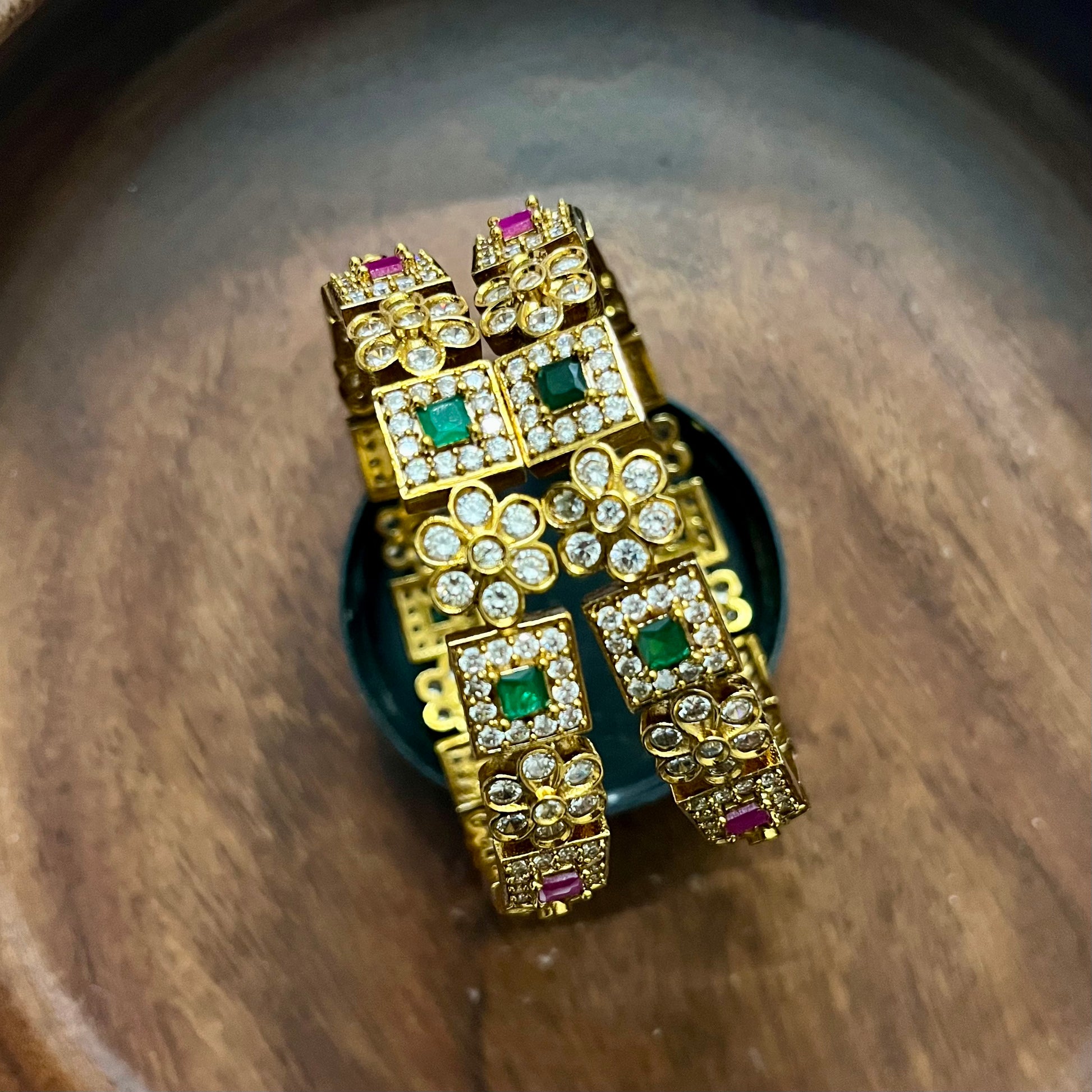 antique gold bangles, floral design bangles, emerald ruby bangles, kundan stone bangles, wedding bangle set, traditional kada bangles, bridal bangles online, festive wear jewelry, stone studded bangles, ethnic jewelry for women, handcrafted Indian bangles, designer bangles for saree, party wear bangles, temple style bangles, royal look bangles