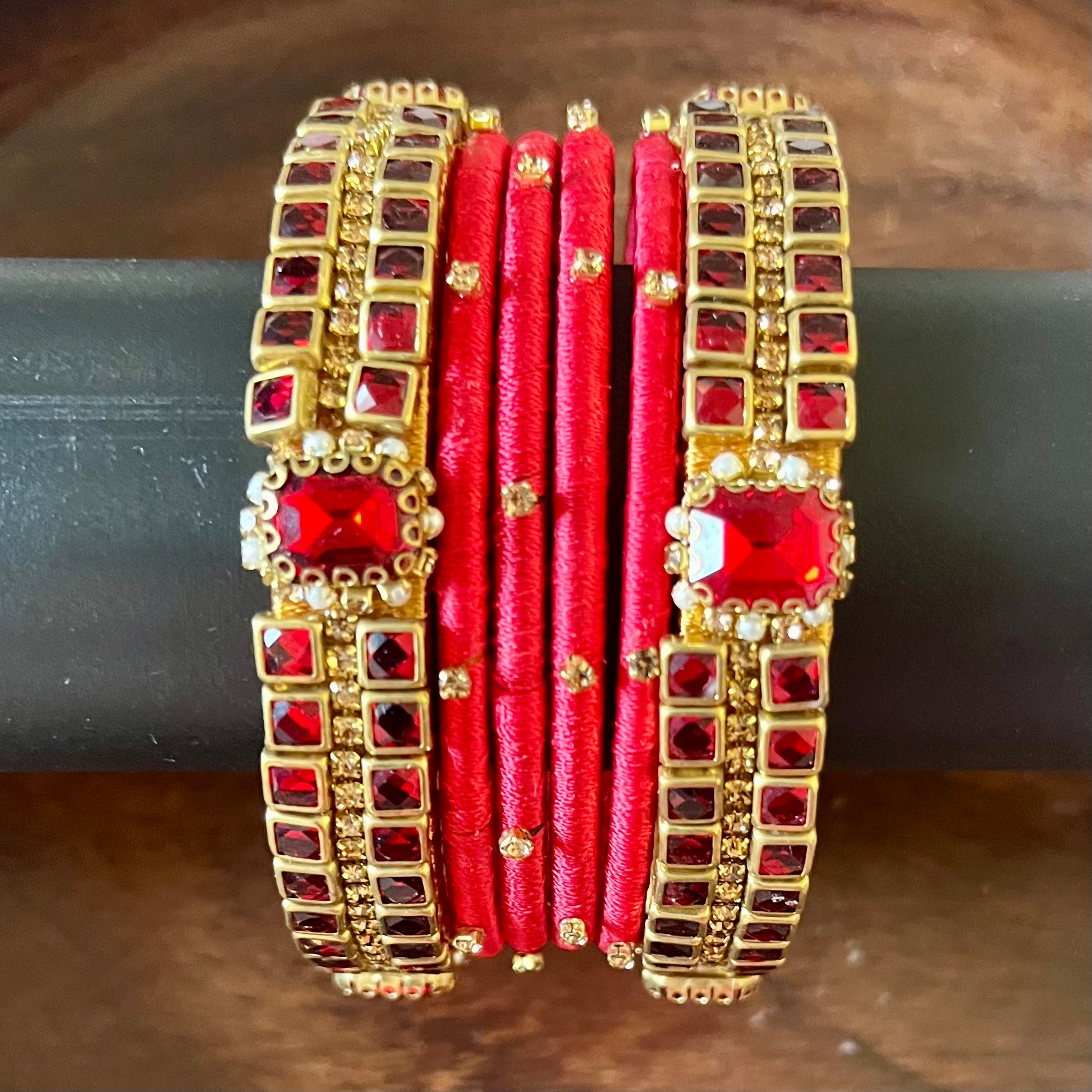 red silk thread bangles, kundan bangles, bridal bangles, wedding bangles, red bangles set, handmade bangles, traditional bangles, festive bangles, Indian bangles, ethnic bangles, red and gold bangles, kundan stone bangles, silk thread jewelry, desi bangles, bangle set for women, party wear bangles, navratri bangles, mehndi bangles, Indian bridal accessories, royal red bangles