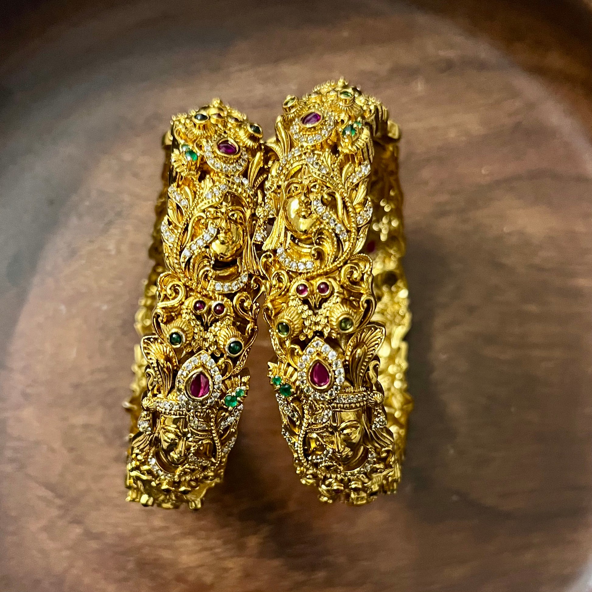 Sri Krishna bangles, Mayura bangles, Krishna peacock bangles, Antique gold bangles, Temple jewelry bangles, Handcrafted kada bangles, Ruby emerald bangles, Traditional Indian bridal jewelry, Spiritual jewelry for weddings, Festive occasion bangles, Indian ethnic bangles, Lord Krishna jewelry, Temple style bangles, Peacock motif jewelry, Hand-set stones bangles, Bridal bangles online India