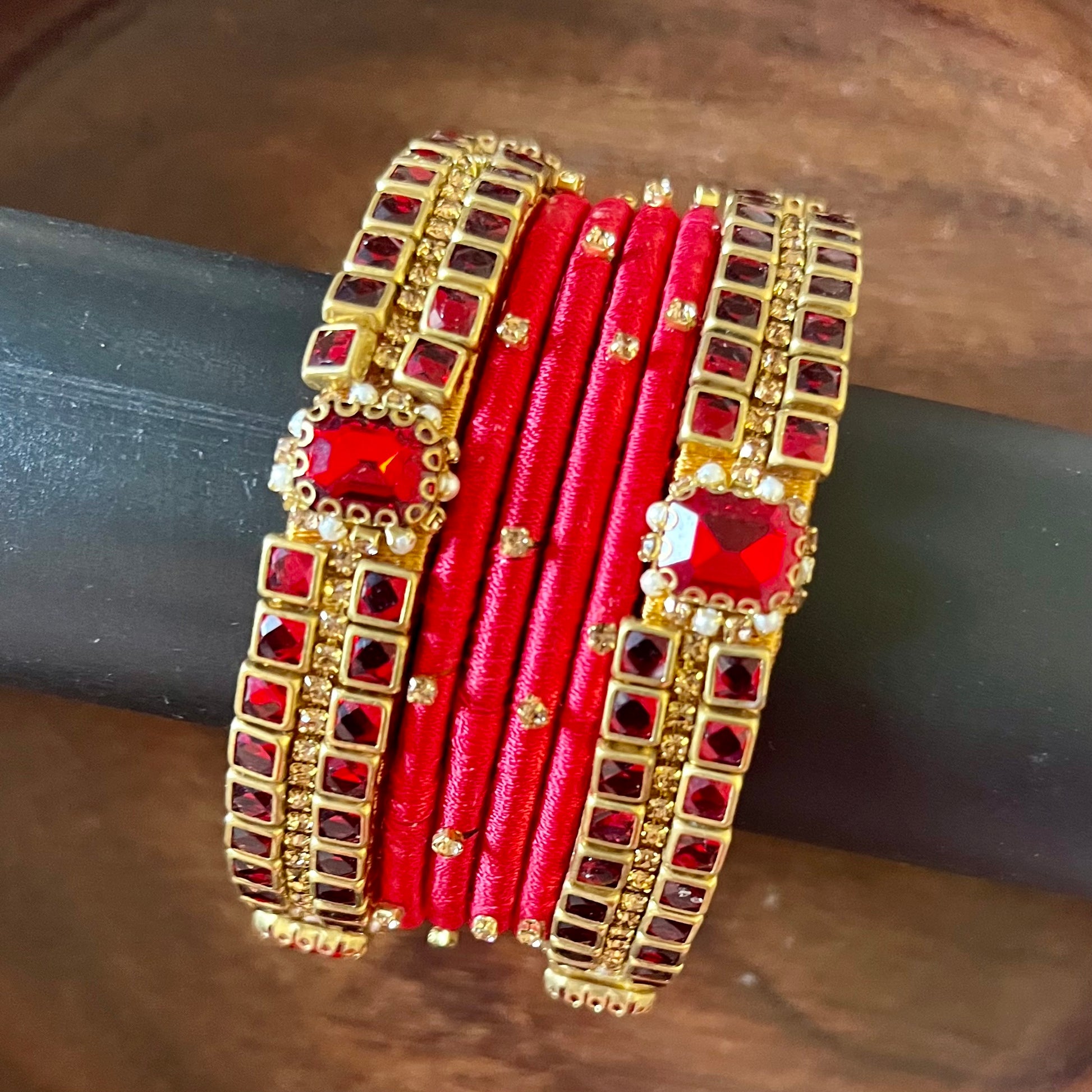 red silk thread bangles, kundan bangles, bridal bangles, wedding bangles, red bangles set, handmade bangles, traditional bangles, festive bangles, Indian bangles, ethnic bangles, red and gold bangles, kundan stone bangles, silk thread jewelry, desi bangles, bangle set for women, party wear bangles, navratri bangles, mehndi bangles, Indian bridal accessories, royal red bangles