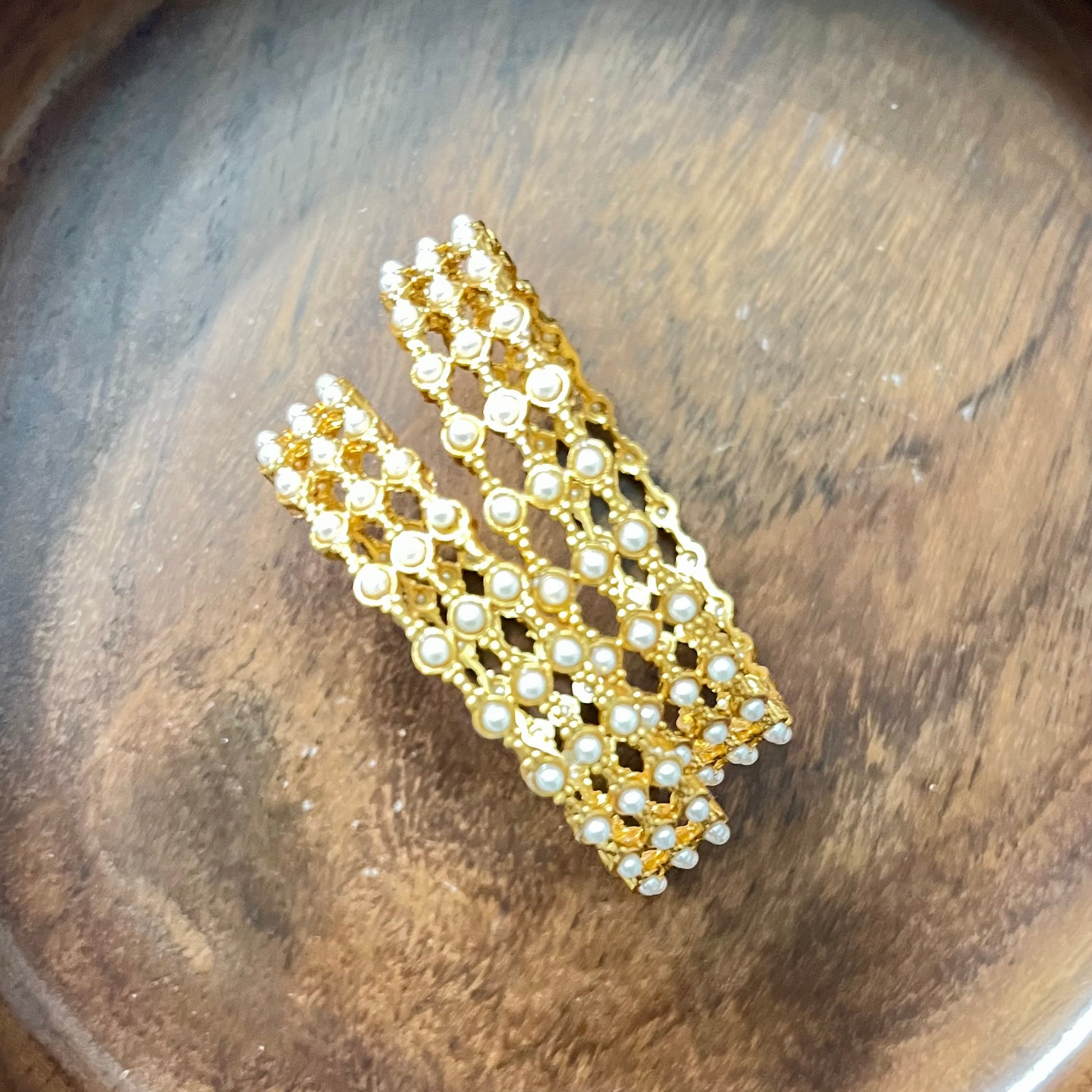 pearl mesh bangles, gold tone bangles, bridal bangles set, traditional kada bangles, pearl kada for women, ethnic bangle set, Indian wedding bangles, festive wear bangles, gold pearl kada, handcrafted bangles, royal pearl bangles, mesh design bangles, kundan style bangles, designer bangles online, party wear bangles for saree
