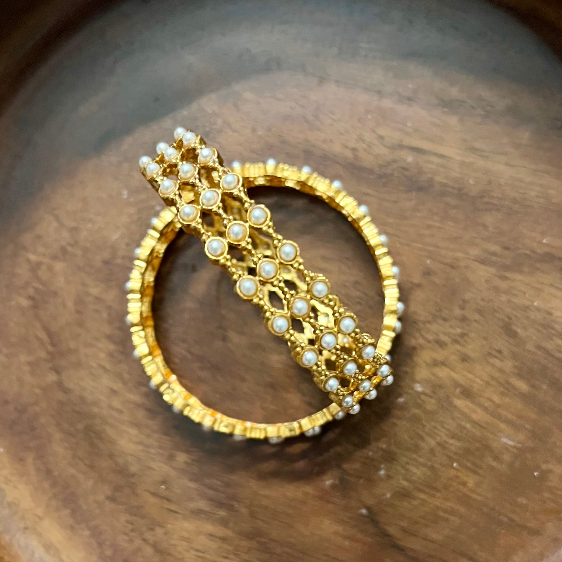 pearl mesh bangles, gold tone bangles, bridal bangles set, traditional kada bangles, pearl kada for women, ethnic bangle set, Indian wedding bangles, festive wear bangles, gold pearl kada, handcrafted bangles, royal pearl bangles, mesh design bangles, kundan style bangles, designer bangles online, party wear bangles for saree