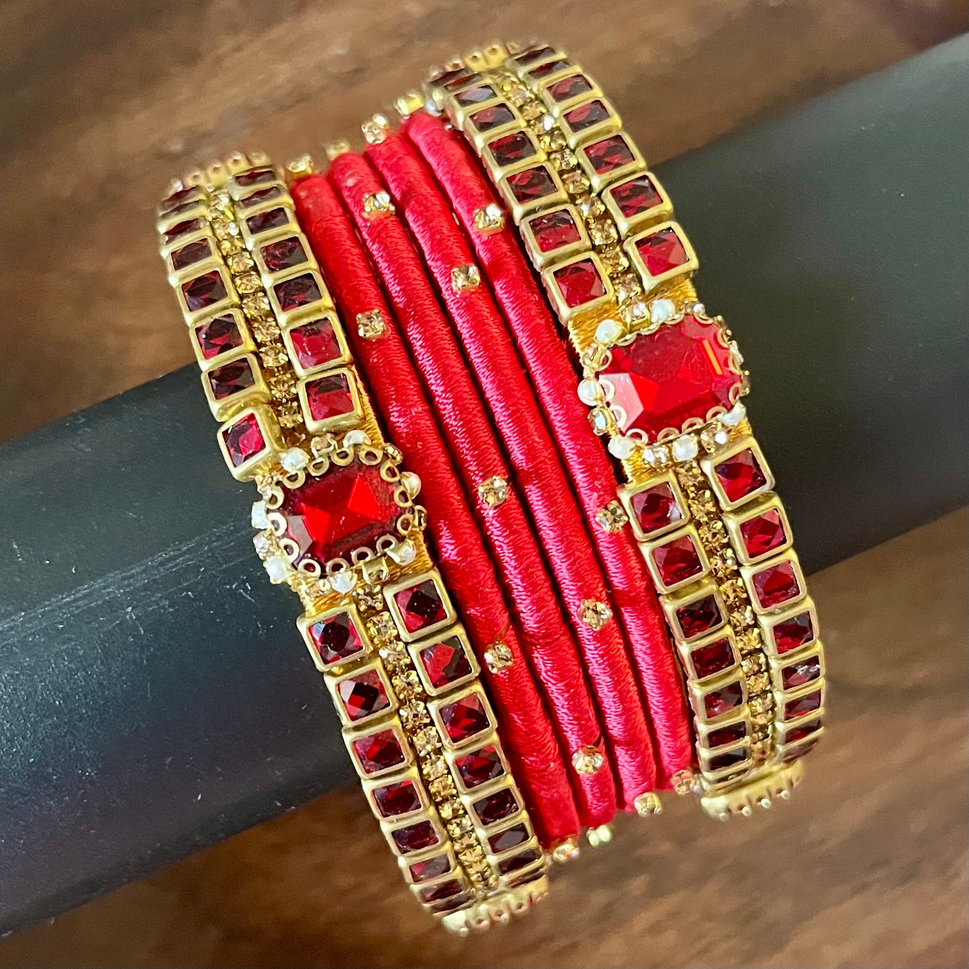 red silk thread bangles, kundan bangles, bridal bangles, wedding bangles, red bangles set, handmade bangles, traditional bangles, festive bangles, Indian bangles, ethnic bangles, red and gold bangles, kundan stone bangles, silk thread jewelry, desi bangles, bangle set for women, party wear bangles, navratri bangles, mehndi bangles, Indian bridal accessories, royal red bangles