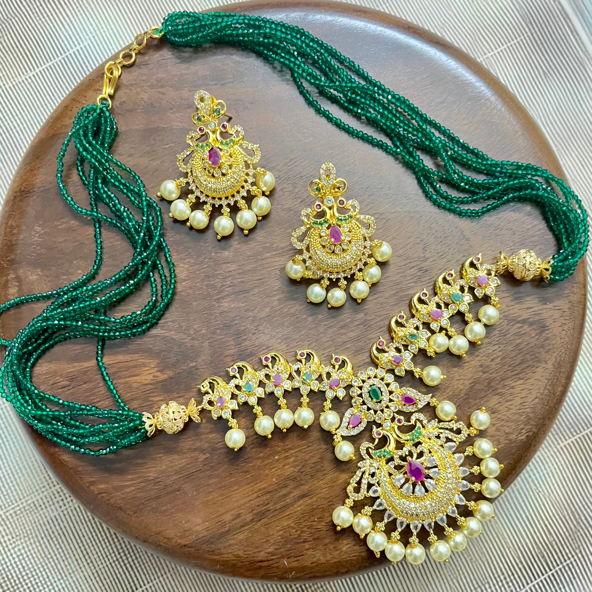 peacock jewelry set, temple jewelry, bridal necklace set, traditional Indian jewelry, antique gold necklace, pearl choker set, wedding jewelry, South Indian jewelry, handcrafted jewelry, emerald bead necklace, designer jewelry set, ethnic necklace set, statement earrings, imitation jewelry, festive jewelry
