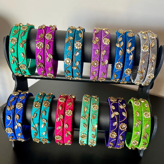 silk thread bangles, designer bangles, handmade bangles, traditional bangles, return gifts for wedding, bangle sets for gifting, assorted color bangles, festive bangles, Indian ethnic bangles, kundan work bangles, bangles for girls, bangles for women, mehendi return gifts, navratri bangles, party wear bangles, bridal bangles, wedding favor bangles, haldi function gifts, colorful bangles, floral design bangles