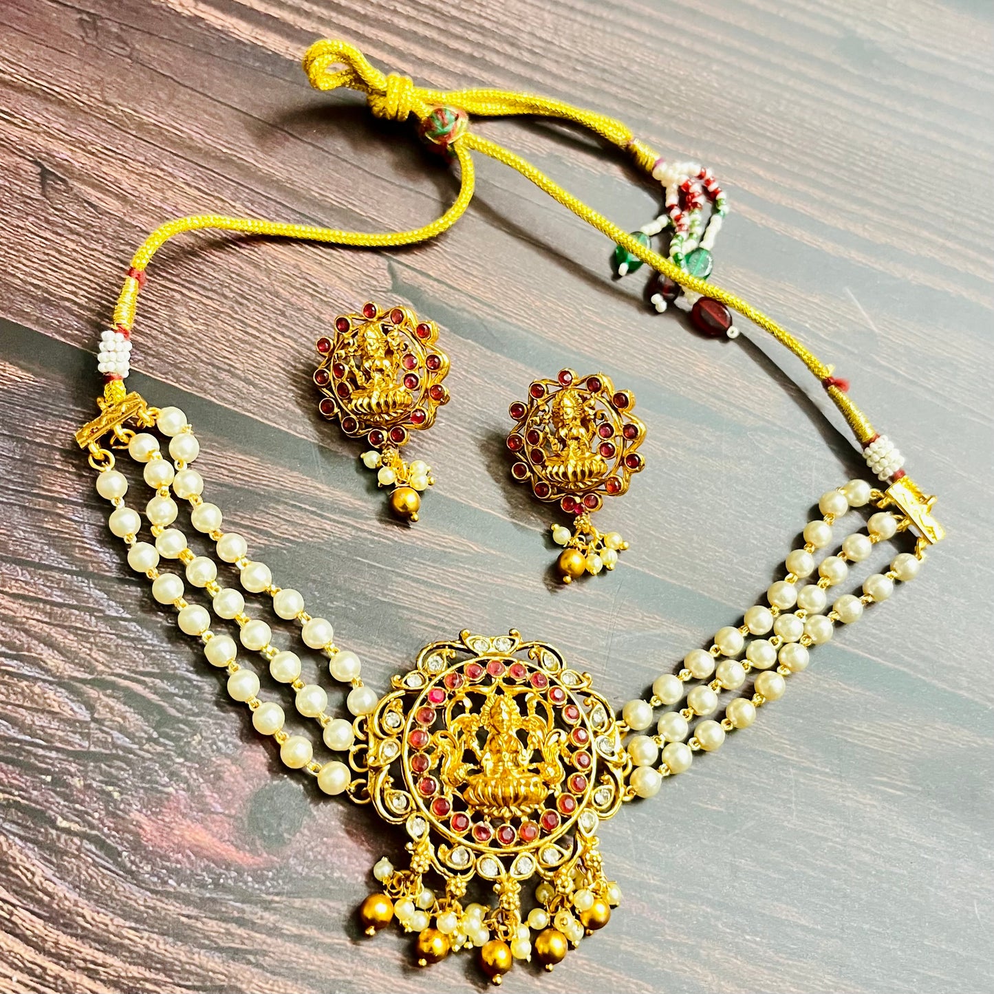 lakshmi choker, temple jewelry, pearl choker, traditional jewelry, Indian jewelry, south Indian style, bridal choker set, handcrafted jewelry, gold plated, festive wear, ethnic accessories, wedding jewelry, goddess jewelry, kundan stones, handmade necklace, antique finish, cultural jewelry, jewelry set with earrings, pooja jewelry, divine design, Indian bride, pearl necklace set, goddess lakshmi, matsya boutique, statement choker