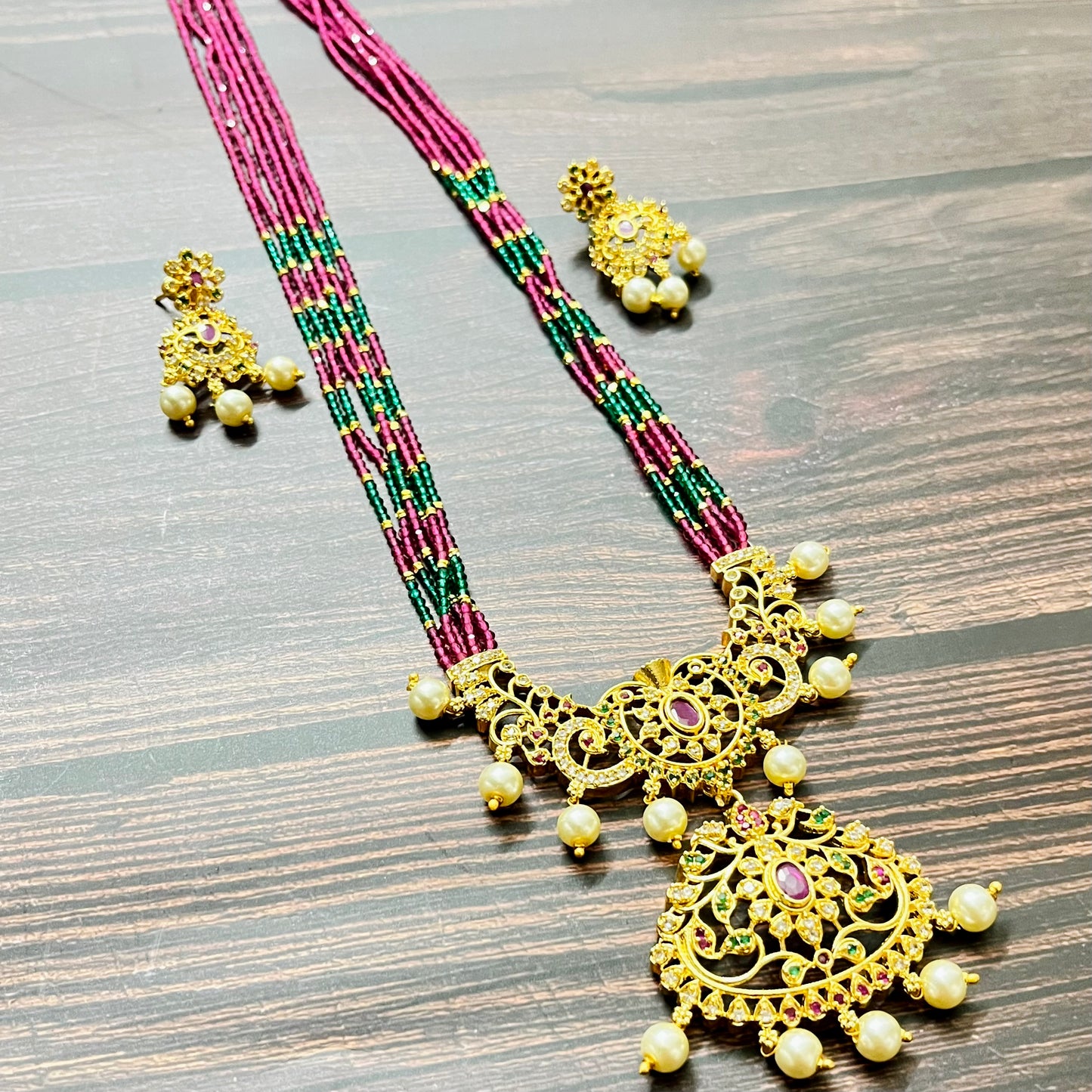 traditional necklace, temple jewelry, bridal jewelry, ethnic wear, gold finish, Indian necklace, pearl necklace, antique jewelry, wedding jewelry, designer jewelry, South Indian jewelry, festive look, handmade jewelry, ruby green beads, jewelry for saree, party wear jewelry, statement necklace, trending jewelry, jewelry set, ethnic necklace, earrings and necklace, kundan work, bridal set, beaded necklace, pearl drops