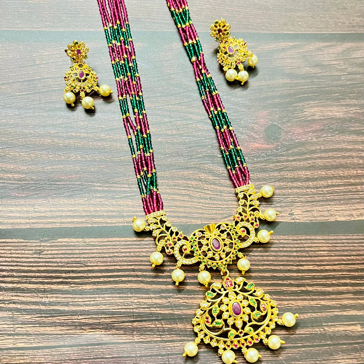 traditional necklace, temple jewelry, bridal jewelry, ethnic wear, gold finish, Indian necklace, pearl necklace, antique jewelry, wedding jewelry, designer jewelry, South Indian jewelry, festive look, handmade jewelry, ruby green beads, jewelry for saree, party wear jewelry, statement necklace, trending jewelry, jewelry set, ethnic necklace, earrings and necklace, kundan work, bridal set, beaded necklace, pearl drops