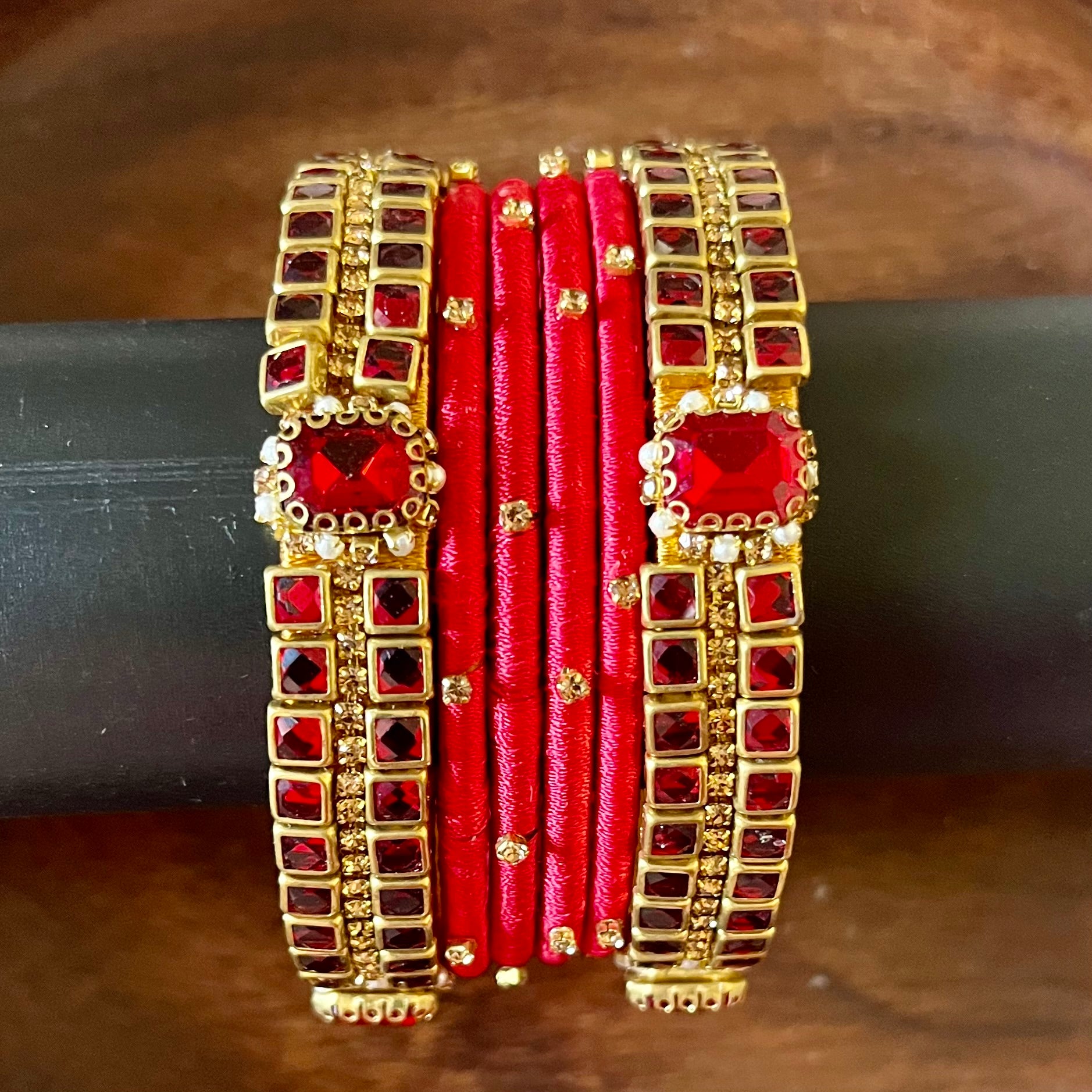 red silk thread bangles, kundan bangles, bridal bangles, wedding bangles, red bangles set, handmade bangles, traditional bangles, festive bangles, Indian bangles, ethnic bangles, red and gold bangles, kundan stone bangles, silk thread jewelry, desi bangles, bangle set for women, party wear bangles, navratri bangles, mehndi bangles, Indian bridal accessories, royal red bangles
