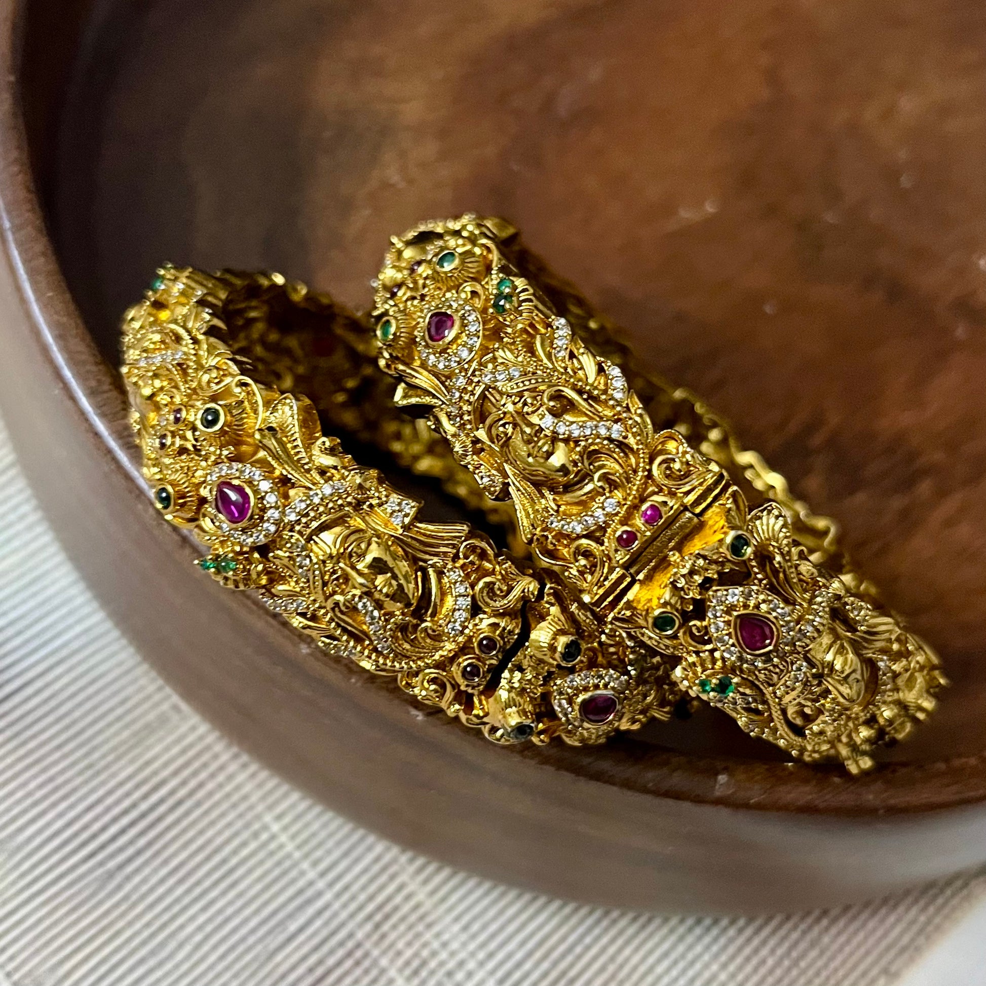 Sri Krishna bangles, Mayura bangles, Krishna peacock bangles, Antique gold bangles, Temple jewelry bangles, Handcrafted kada bangles, Ruby emerald bangles, Traditional Indian bridal jewelry, Spiritual jewelry for weddings, Festive occasion bangles, Indian ethnic bangles, Lord Krishna jewelry, Temple style bangles, Peacock motif jewelry, Hand-set stones bangles, Bridal bangles online India