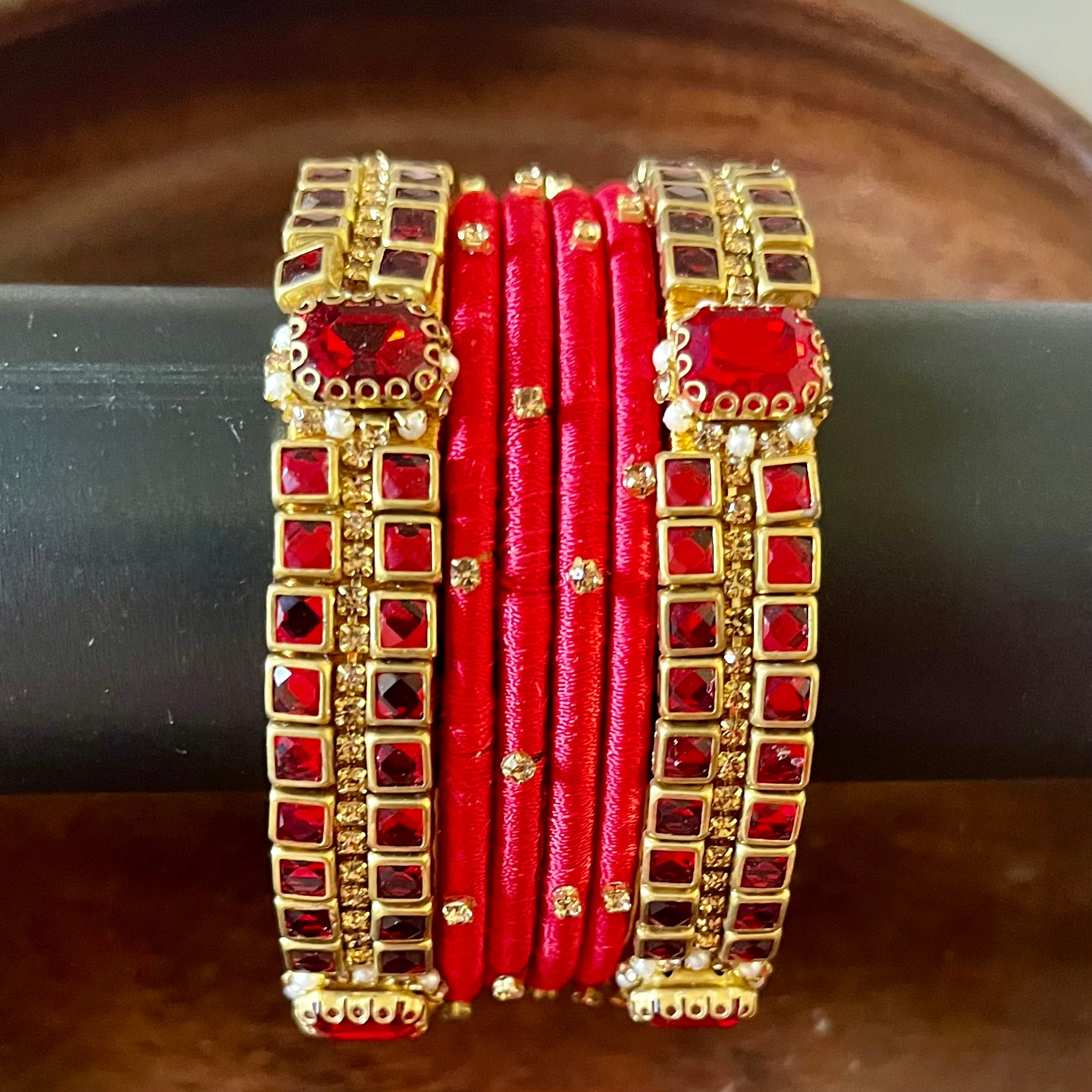red silk thread bangles, kundan bangles, bridal bangles, wedding bangles, red bangles set, handmade bangles, traditional bangles, festive bangles, Indian bangles, ethnic bangles, red and gold bangles, kundan stone bangles, silk thread jewelry, desi bangles, bangle set for women, party wear bangles, navratri bangles, mehndi bangles, Indian bridal accessories, royal red bangles