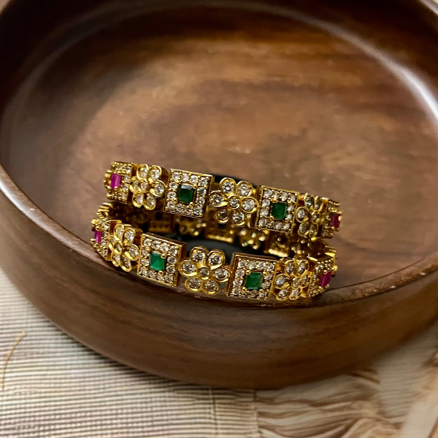 antique gold bangles, floral design bangles, emerald ruby bangles, kundan stone bangles, wedding bangle set, traditional kada bangles, bridal bangles online, festive wear jewelry, stone studded bangles, ethnic jewelry for women, handcrafted Indian bangles, designer bangles for saree, party wear bangles, temple style bangles, royal look bangles