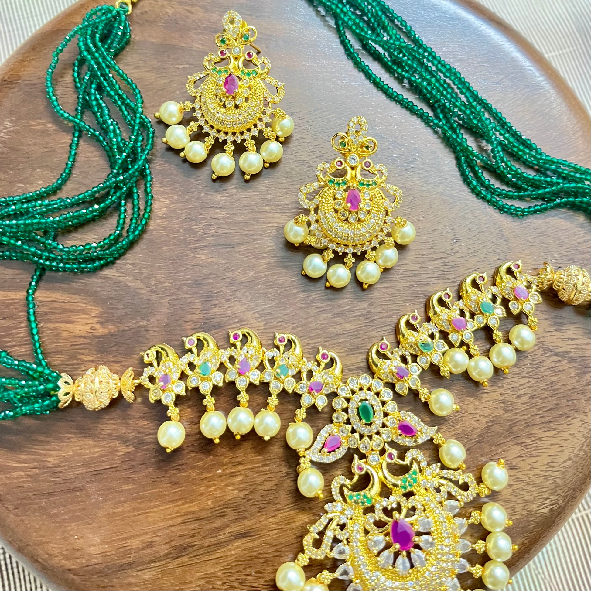peacock jewelry set, temple jewelry, bridal necklace set, traditional Indian jewelry, antique gold necklace, pearl choker set, wedding jewelry, South Indian jewelry, handcrafted jewelry, emerald bead necklace, designer jewelry set, ethnic necklace set, statement earrings, imitation jewelry, festive jewelry