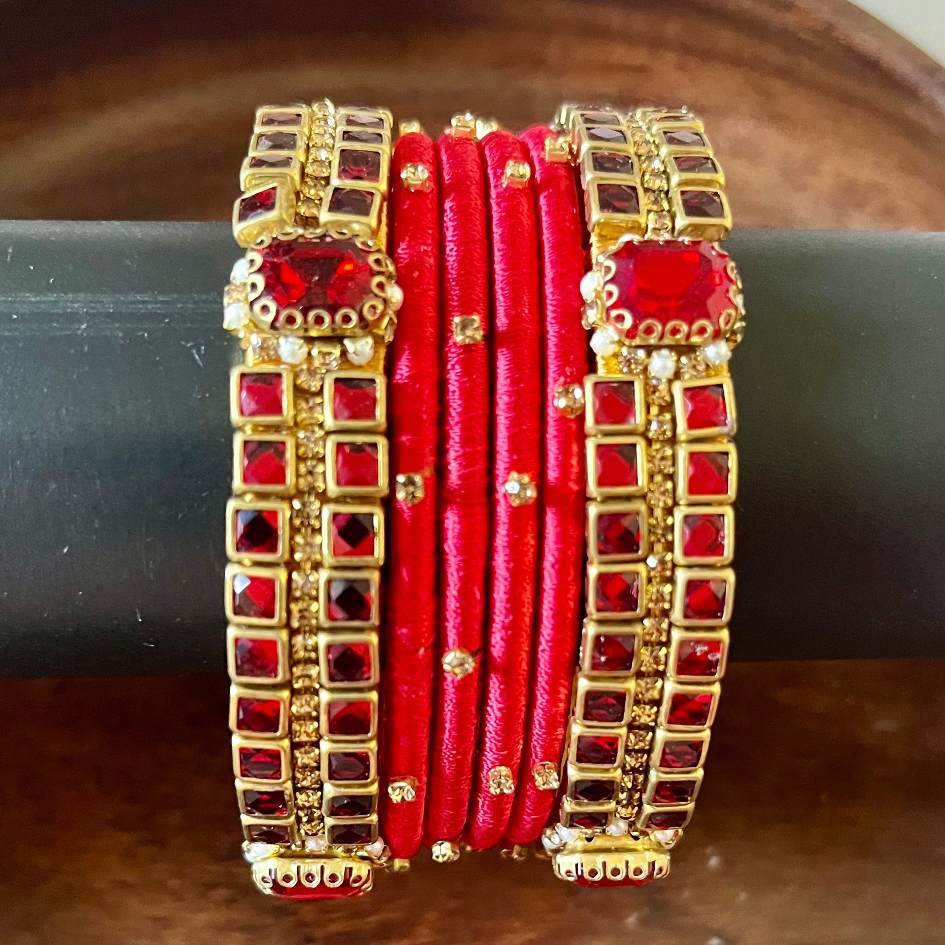 red silk thread bangles, kundan bangles, bridal bangles, wedding bangles, red bangles set, handmade bangles, traditional bangles, festive bangles, Indian bangles, ethnic bangles, red and gold bangles, kundan stone bangles, silk thread jewelry, desi bangles, bangle set for women, party wear bangles, navratri bangles, mehndi bangles, Indian bridal accessories, royal red bangles