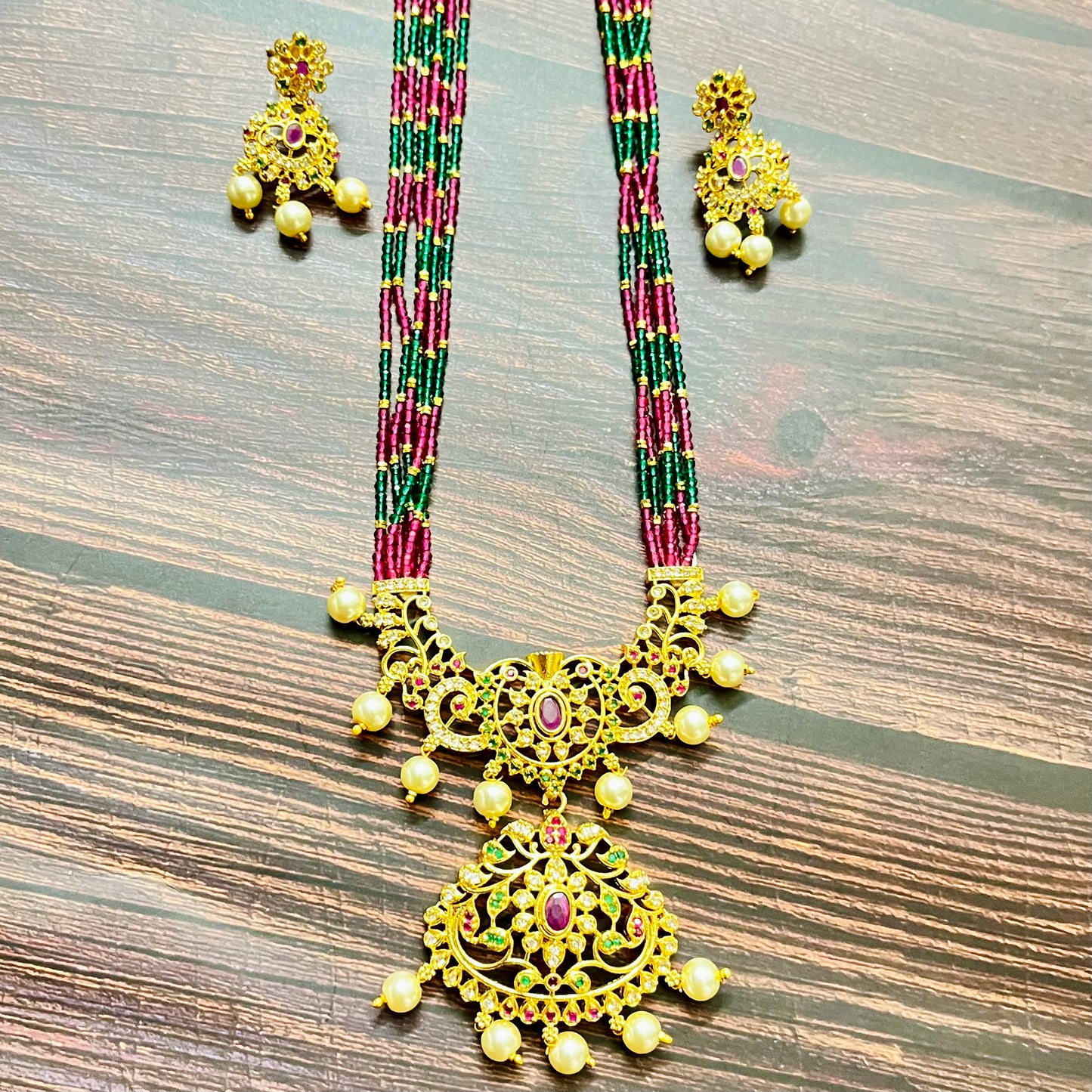 traditional necklace, temple jewelry, bridal jewelry, ethnic wear, gold finish, Indian necklace, pearl necklace, antique jewelry, wedding jewelry, designer jewelry, South Indian jewelry, festive look, handmade jewelry, ruby green beads, jewelry for saree, party wear jewelry, statement necklace, trending jewelry, jewelry set, ethnic necklace, earrings and necklace, kundan work, bridal set, beaded necklace, pearl drops