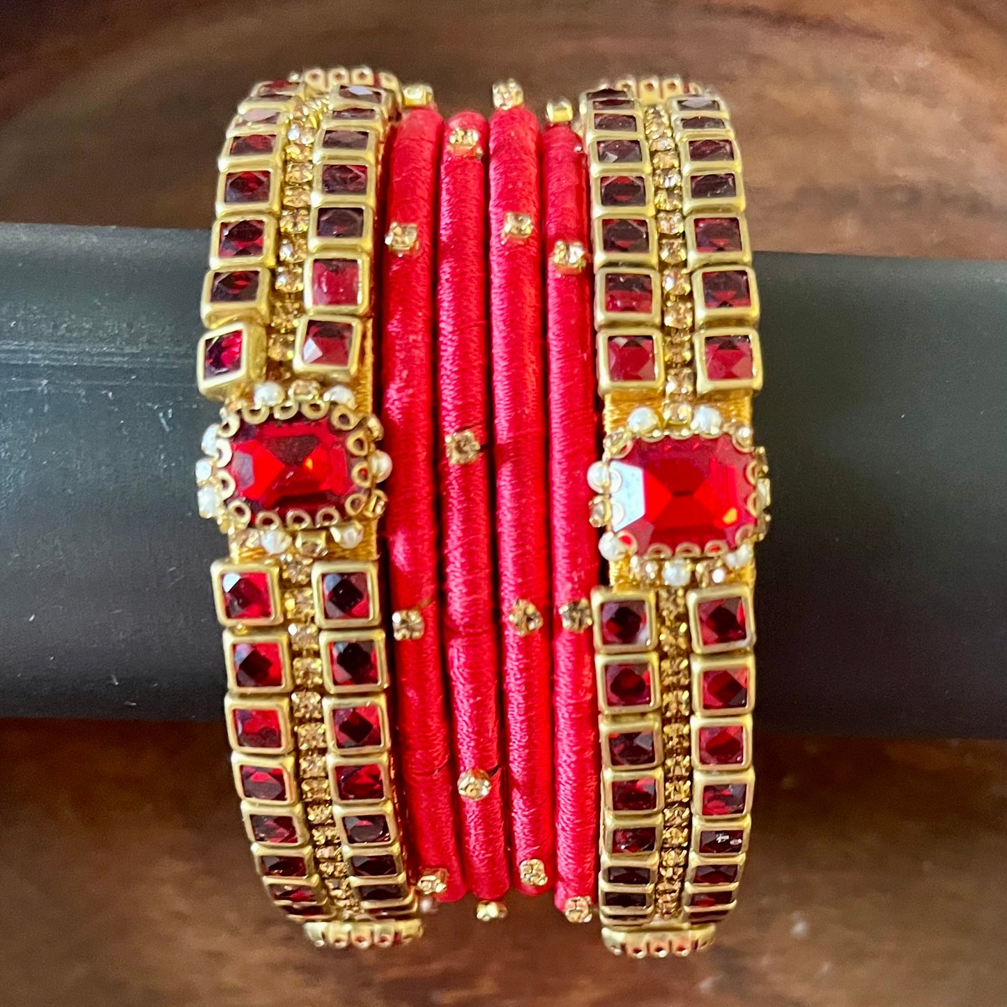 red silk thread bangles, kundan bangles, bridal bangles, wedding bangles, red bangles set, handmade bangles, traditional bangles, festive bangles, Indian bangles, ethnic bangles, red and gold bangles, kundan stone bangles, silk thread jewelry, desi bangles, bangle set for women, party wear bangles, navratri bangles, mehndi bangles, Indian bridal accessories, royal red bangles