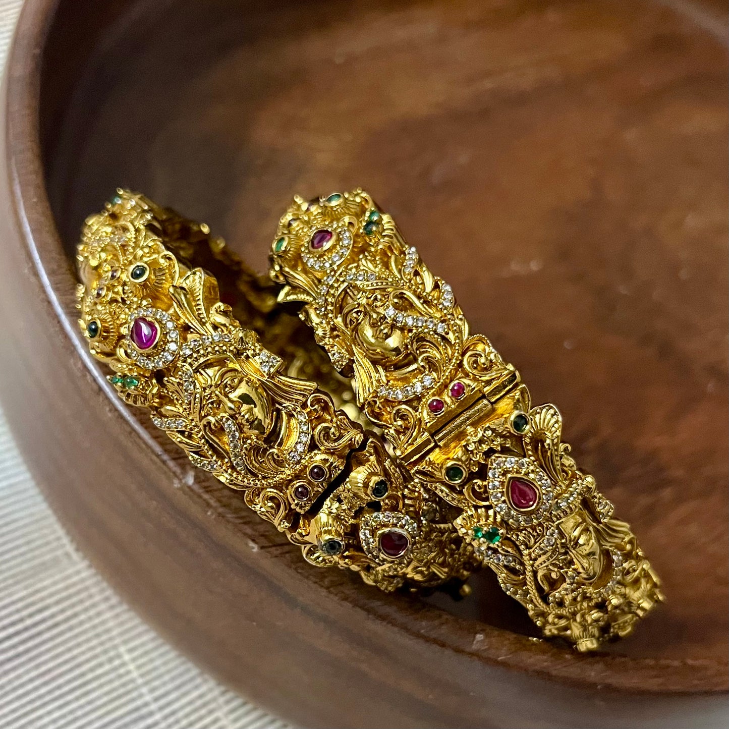 Sri Krishna bangles, Mayura bangles, Krishna peacock bangles, Antique gold bangles, Temple jewelry bangles, Handcrafted kada bangles, Ruby emerald bangles, Traditional Indian bridal jewelry, Spiritual jewelry for weddings, Festive occasion bangles, Indian ethnic bangles, Lord Krishna jewelry, Temple style bangles, Peacock motif jewelry, Hand-set stones bangles, Bridal bangles online India