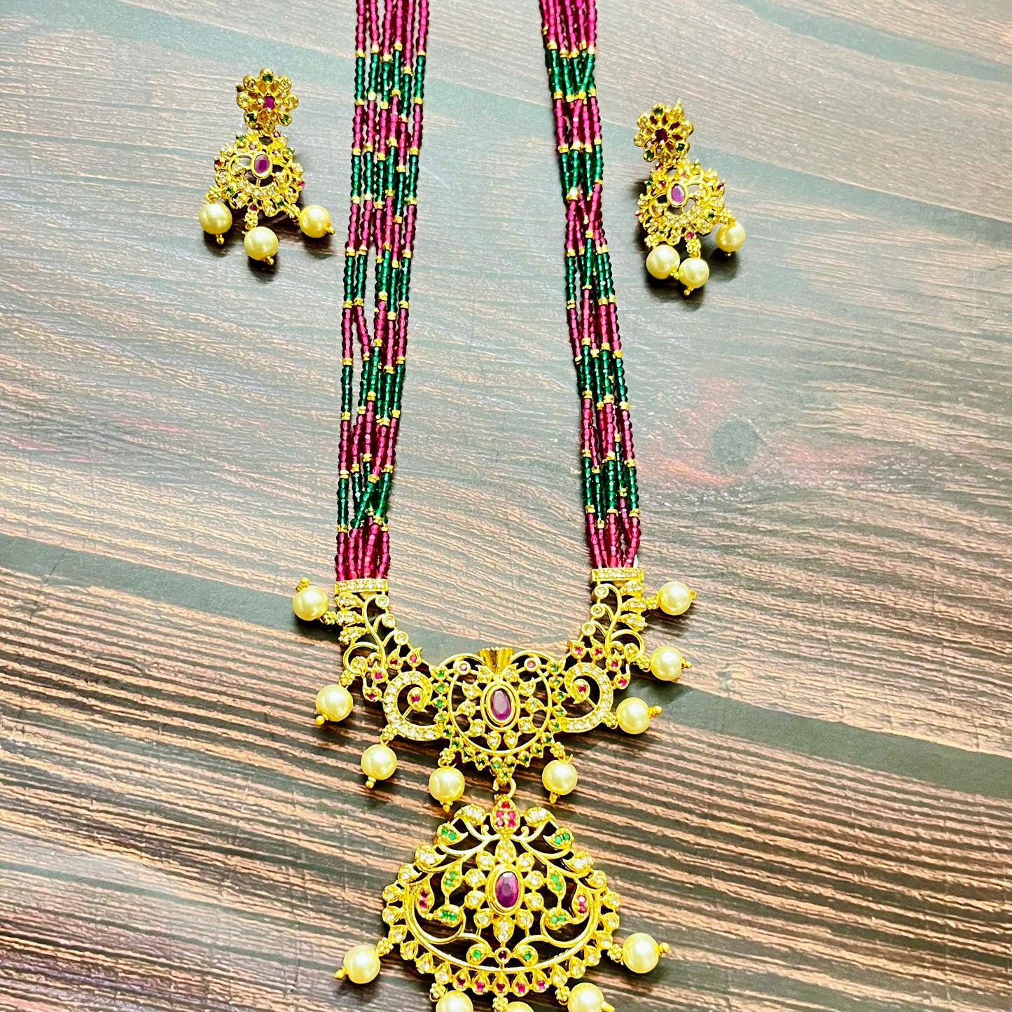 traditional necklace, temple jewelry, bridal jewelry, ethnic wear, gold finish, Indian necklace, pearl necklace, antique jewelry, wedding jewelry, designer jewelry, South Indian jewelry, festive look, handmade jewelry, ruby green beads, jewelry for saree, party wear jewelry, statement necklace, trending jewelry, jewelry set, ethnic necklace, earrings and necklace, kundan work, bridal set, beaded necklace, pearl drops