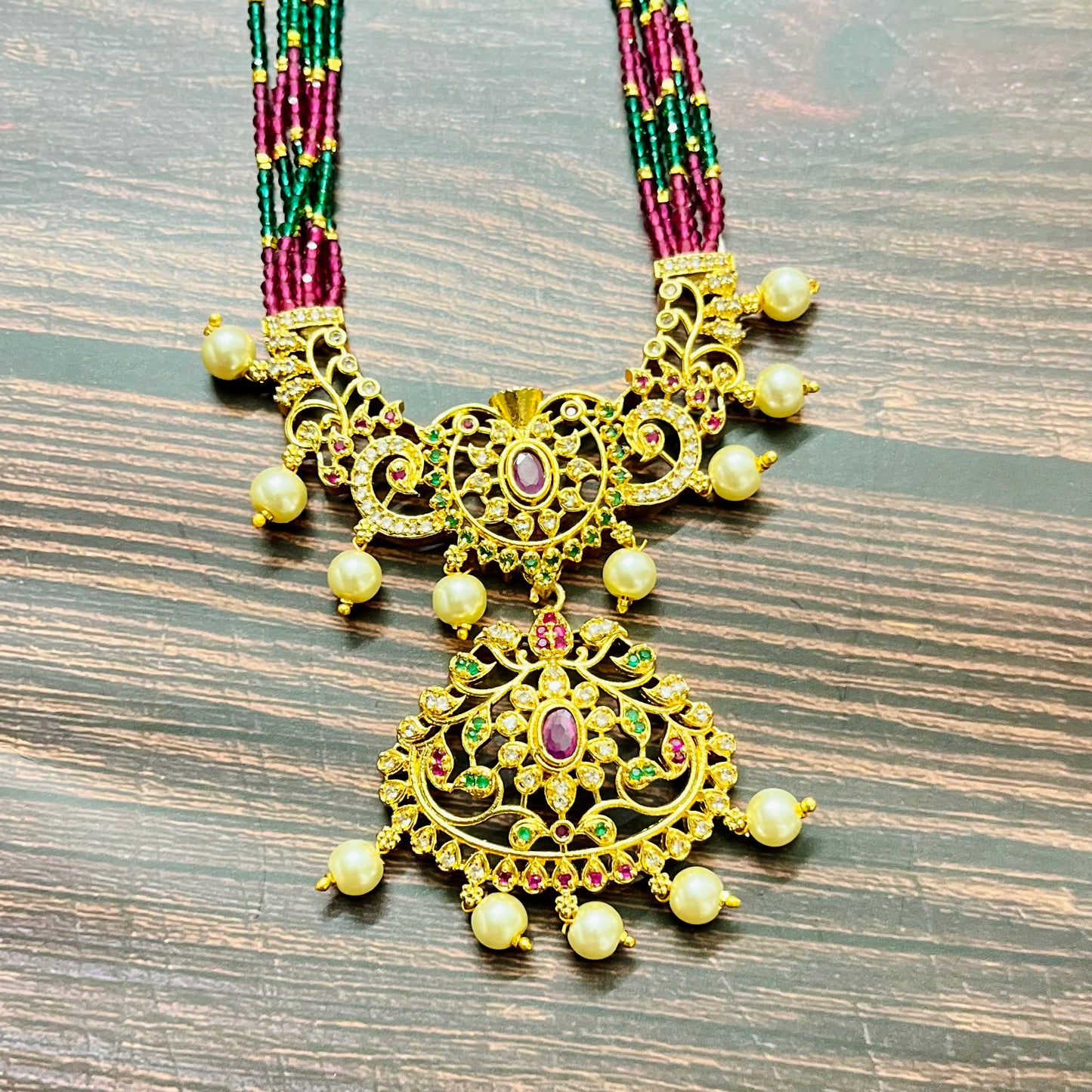 traditional necklace, temple jewelry, bridal jewelry, ethnic wear, gold finish, Indian necklace, pearl necklace, antique jewelry, wedding jewelry, designer jewelry, South Indian jewelry, festive look, handmade jewelry, ruby green beads, jewelry for saree, party wear jewelry, statement necklace, trending jewelry, jewelry set, ethnic necklace, earrings and necklace, kundan work, bridal set, beaded necklace, pearl drops