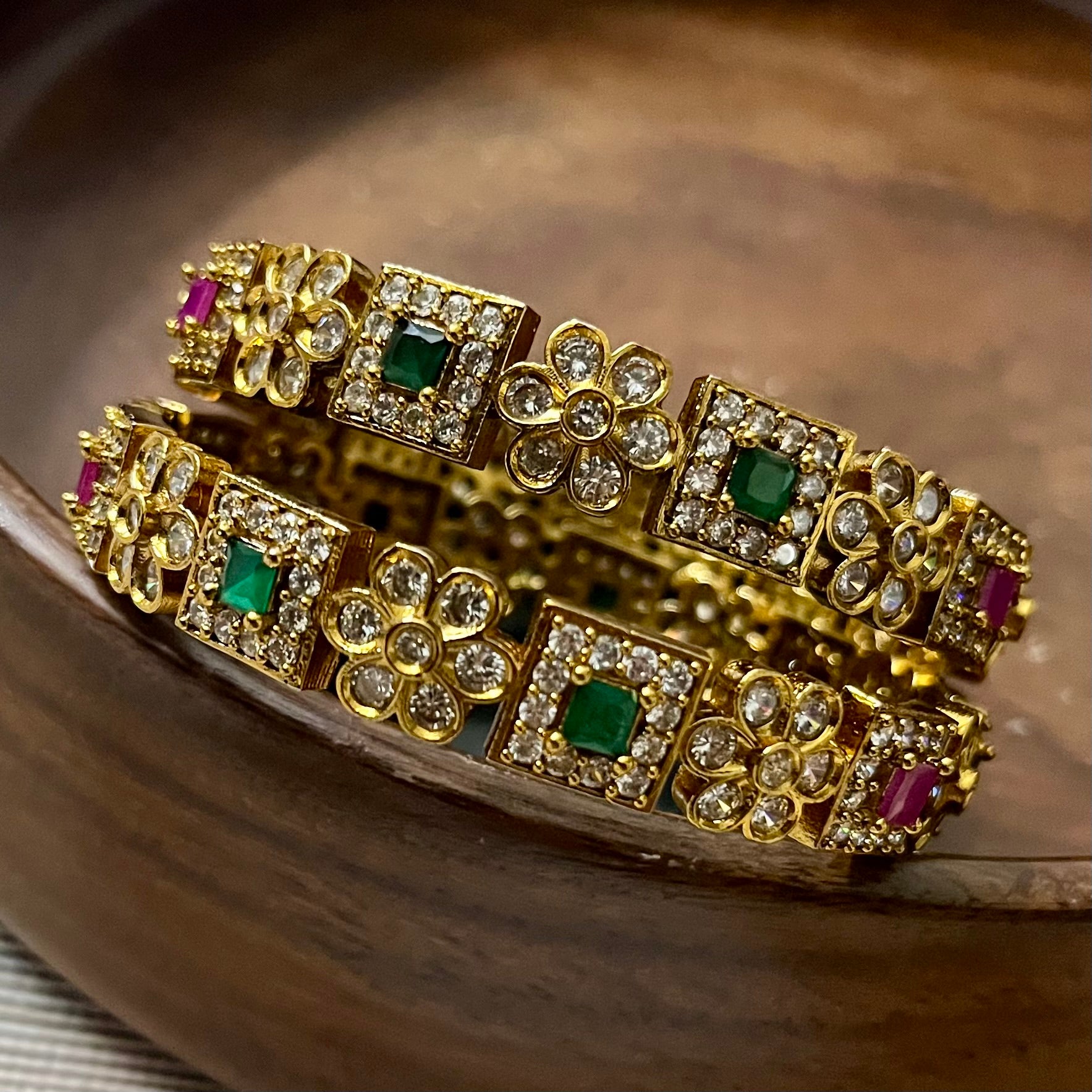 antique gold bangles, floral design bangles, emerald ruby bangles, kundan stone bangles, wedding bangle set, traditional kada bangles, bridal bangles online, festive wear jewelry, stone studded bangles, ethnic jewelry for women, handcrafted Indian bangles, designer bangles for saree, party wear bangles, temple style bangles, royal look bangles