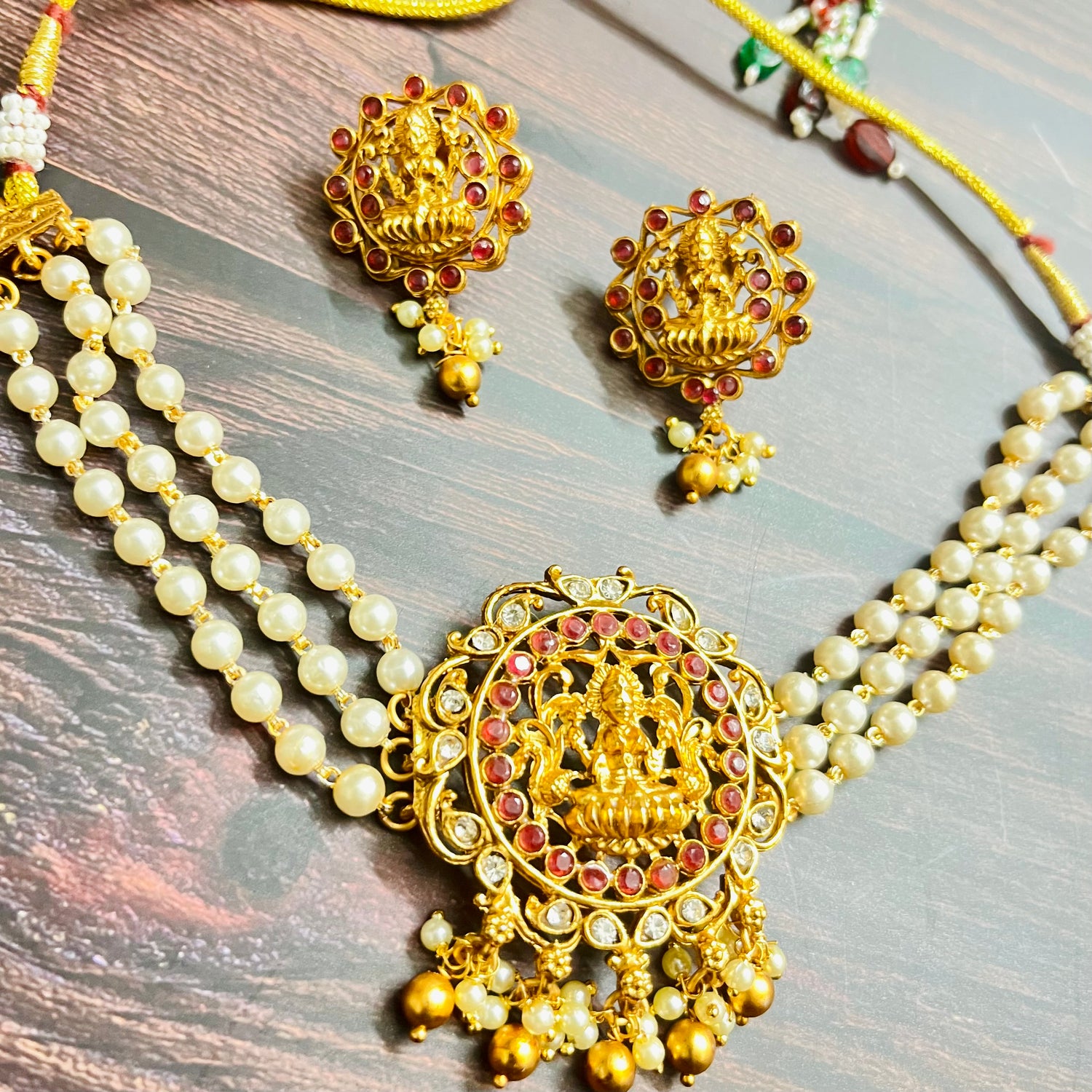 lakshmi choker, temple jewelry, pearl choker, traditional jewelry, Indian jewelry, south Indian style, bridal choker set, handcrafted jewelry, gold plated, festive wear, ethnic accessories, wedding jewelry, goddess jewelry, kundan stones, handmade necklace, antique finish, cultural jewelry, jewelry set with earrings, pooja jewelry, divine design, Indian bride, pearl necklace set, goddess lakshmi, matsya boutique, statement choker