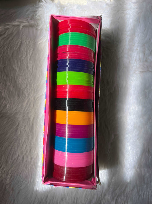 Colorful plastic bangles used as the base for making handmade silk thread bangles