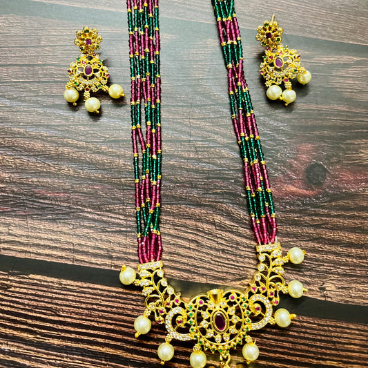 traditional necklace, temple jewelry, bridal jewelry, ethnic wear, gold finish, Indian necklace, pearl necklace, antique jewelry, wedding jewelry, designer jewelry, South Indian jewelry, festive look, handmade jewelry, ruby green beads, jewelry for saree, party wear jewelry, statement necklace, trending jewelry, jewelry set, ethnic necklace, earrings and necklace, kundan work, bridal set, beaded necklace, pearl drops