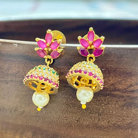 Traditional jewelry, South Indian jewelry, ruby jhumka, handcrafted earrings, Indian festive jewelry, wedding jewelry, Kanjeevaram saree accessories, silk lehenga jewelry, pearl jhumka, ethnic earrings, handmade jewelry India, bridal earrings, classical dance jewelry, festive accessories, gold tone jewelry, floral jhumka, lightweight earrings, Indian heritage jewelry, ethnic fashion accessories, royal jewelry, Indian traditional earrings, statement jhumkas, Indian ethnic wear, festival jewelry, Matsya Bouti