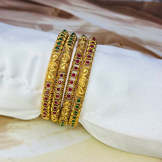 designer imitation bangles, red and green stone bangles, traditional jewelry, ethnic bangles, handmade bangles, Indian jewelry, imitation bangles online, festive accessories, handcrafted jewelry, stylish bangles, wedding jewelry, ethnic wear accessories, Matsya Boutique bangles, jewelry for women, designer jewelry