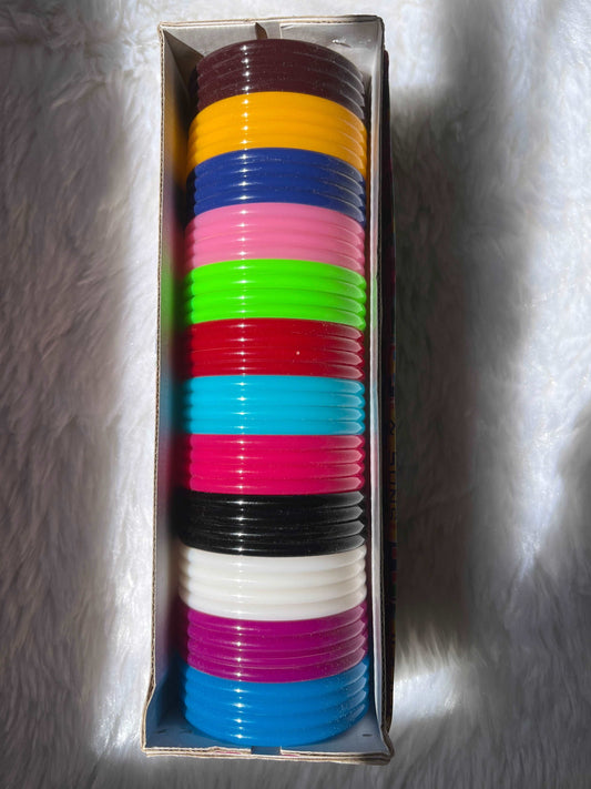 Colorful plastic bangles used as the base for making handmade silk thread bangles