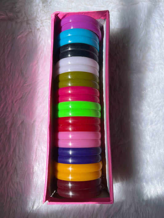 Colorful plastic bangles used as the base for making handmade silk thread bangles