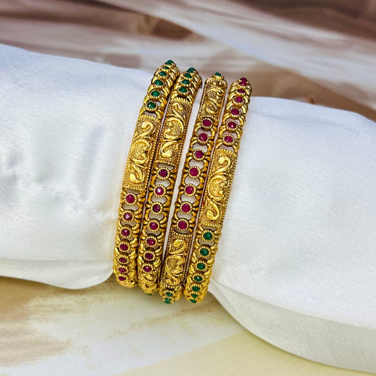 designer imitation bangles, red and green stone bangles, traditional jewelry, ethnic bangles, handmade bangles, Indian jewelry, imitation bangles online, festive accessories, handcrafted jewelry, stylish bangles, wedding jewelry, ethnic wear accessories, Matsya Boutique bangles, jewelry for women, designer jewelry