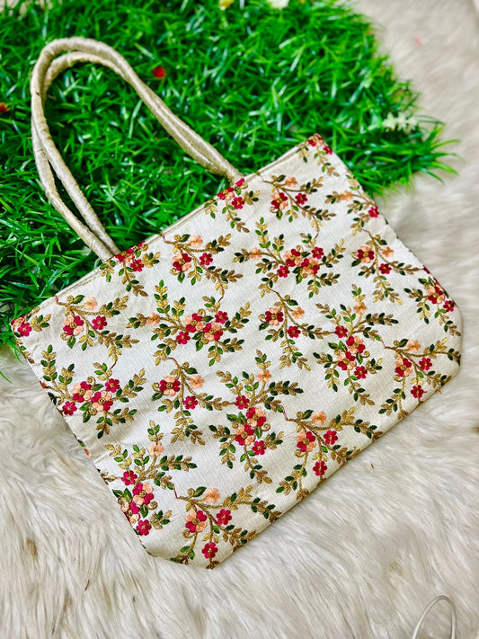 "Beautifully handcrafted embroidery bags with intricate patterns, ideal for return gifts, combining traditional artistry with a touch of elegance for special occasions."